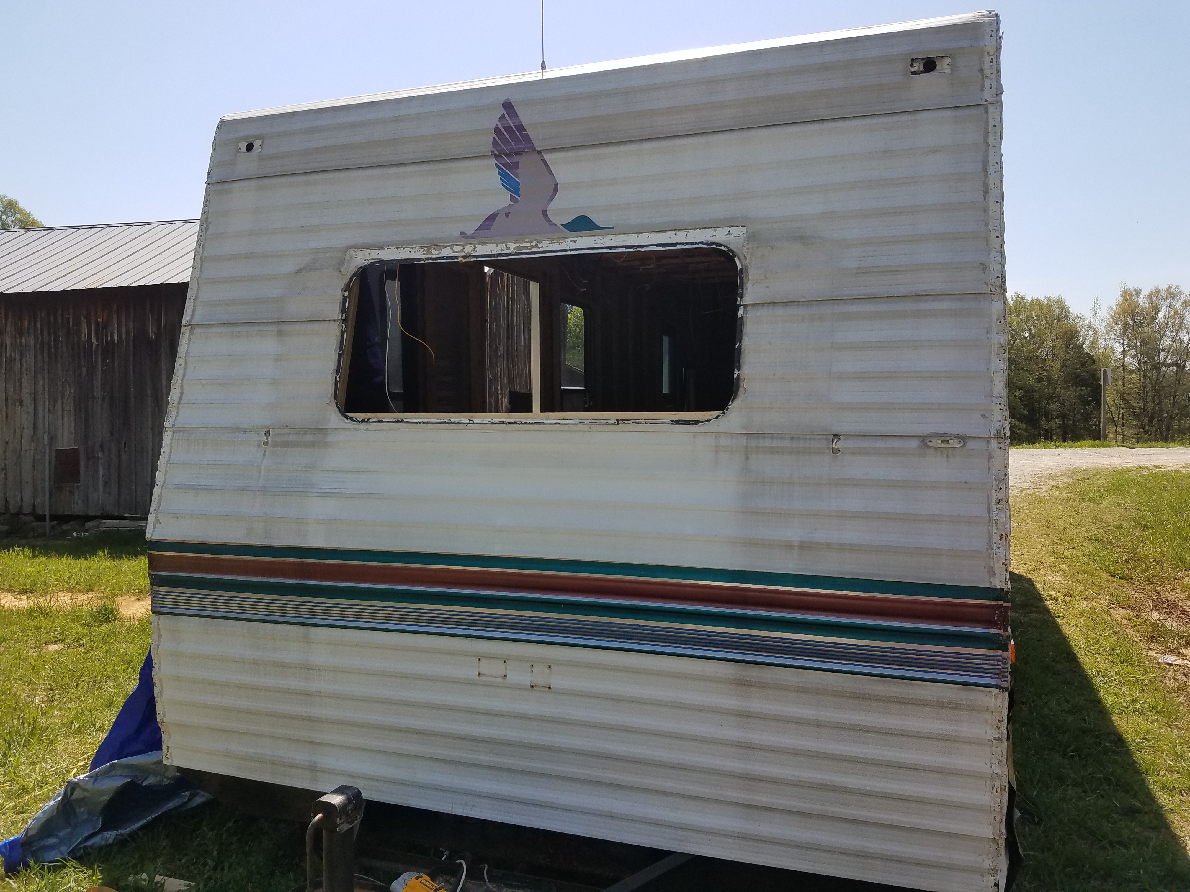 The front of the travel trailer with siding replaced