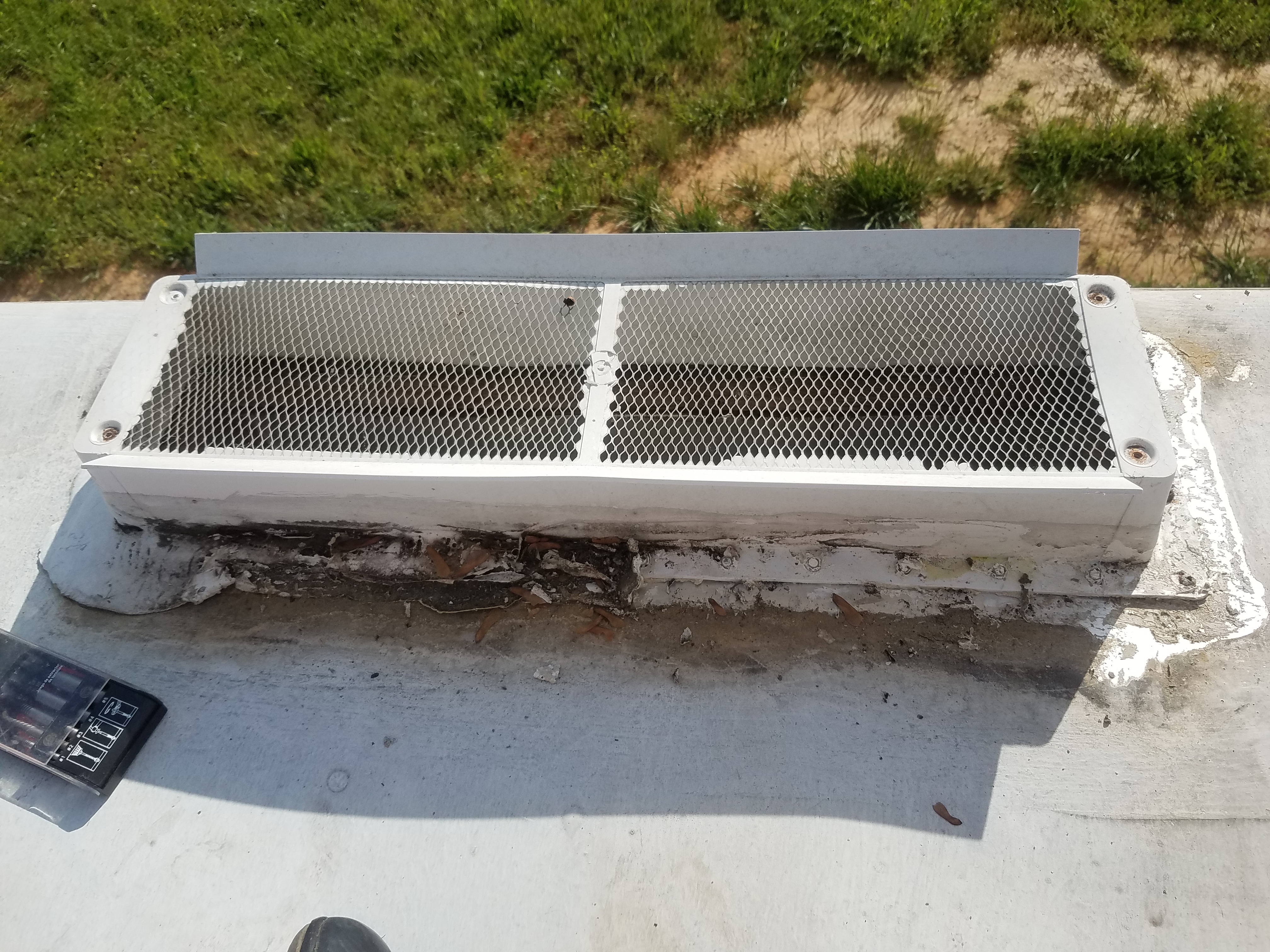 Refridgerator vent without its cover on the roof of he travel trailer