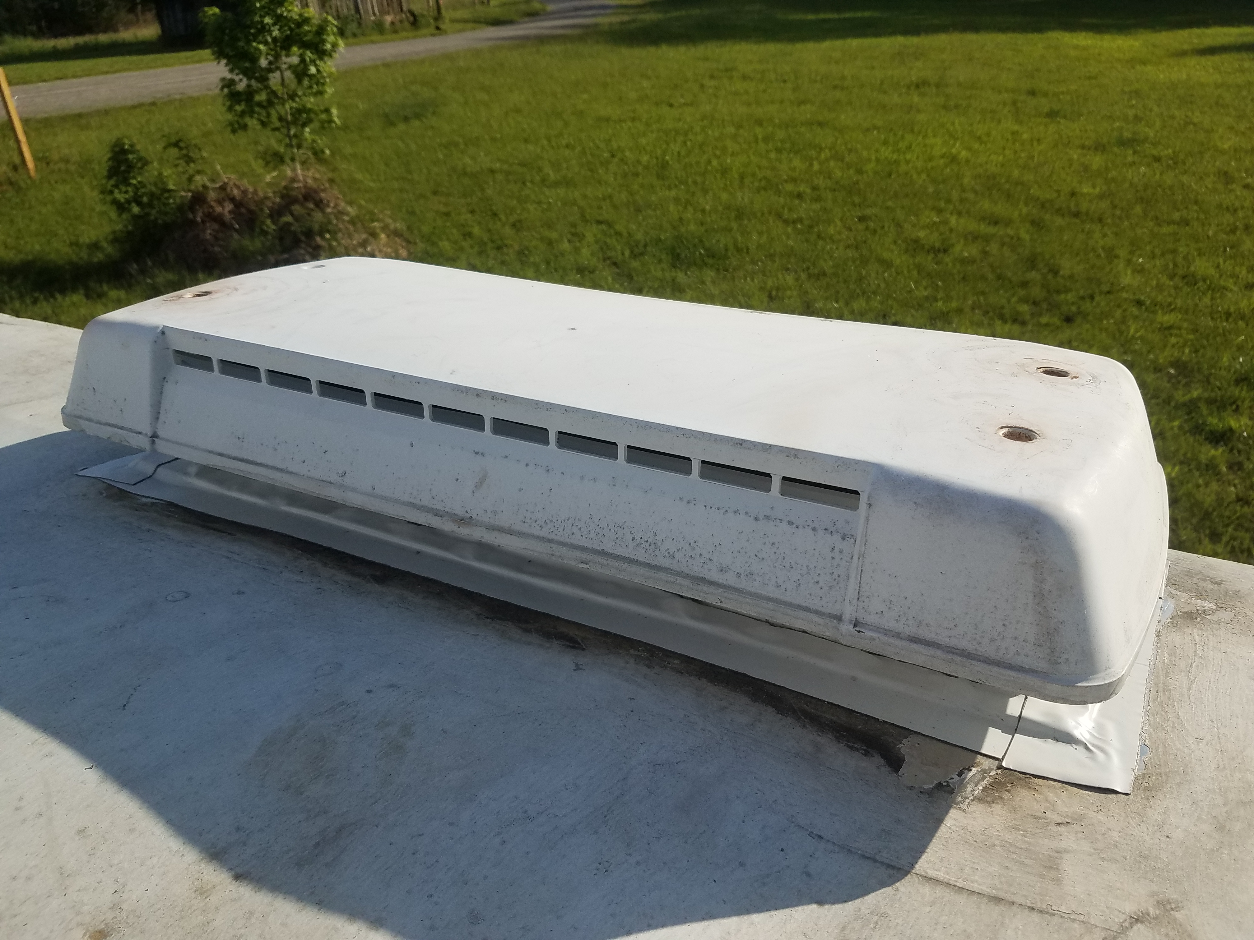 Refridgerator vent with the cover on the travel trailer roof