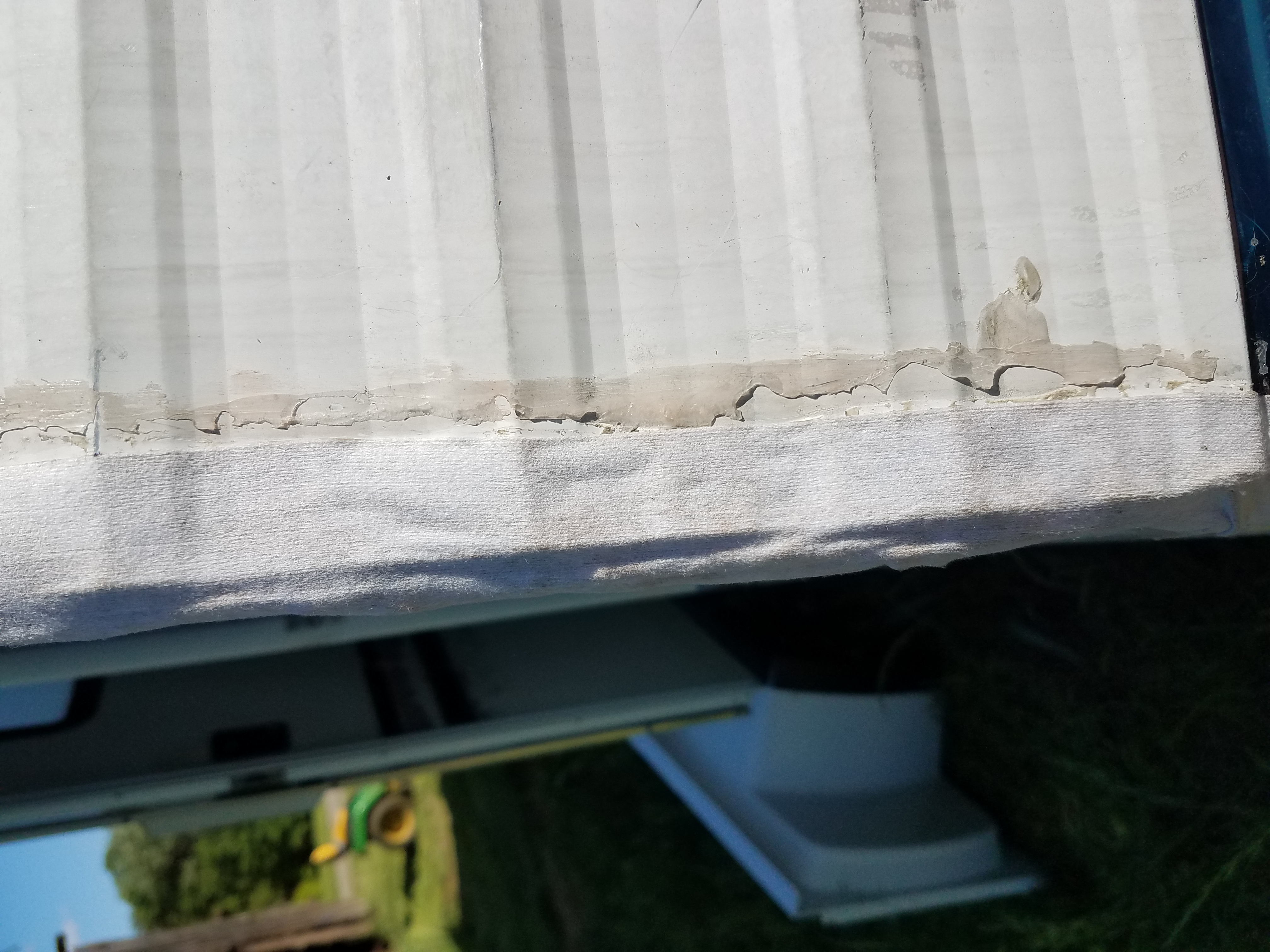 The corner of the travel trailer sealed with seam tape before being properly sealed.
