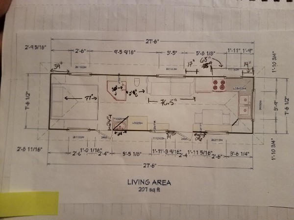 The page of a notebook with a floor layout drawing of the travel trailer