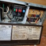 The coverter fuse box in the travel trailer opened to expose the fuses and wiring