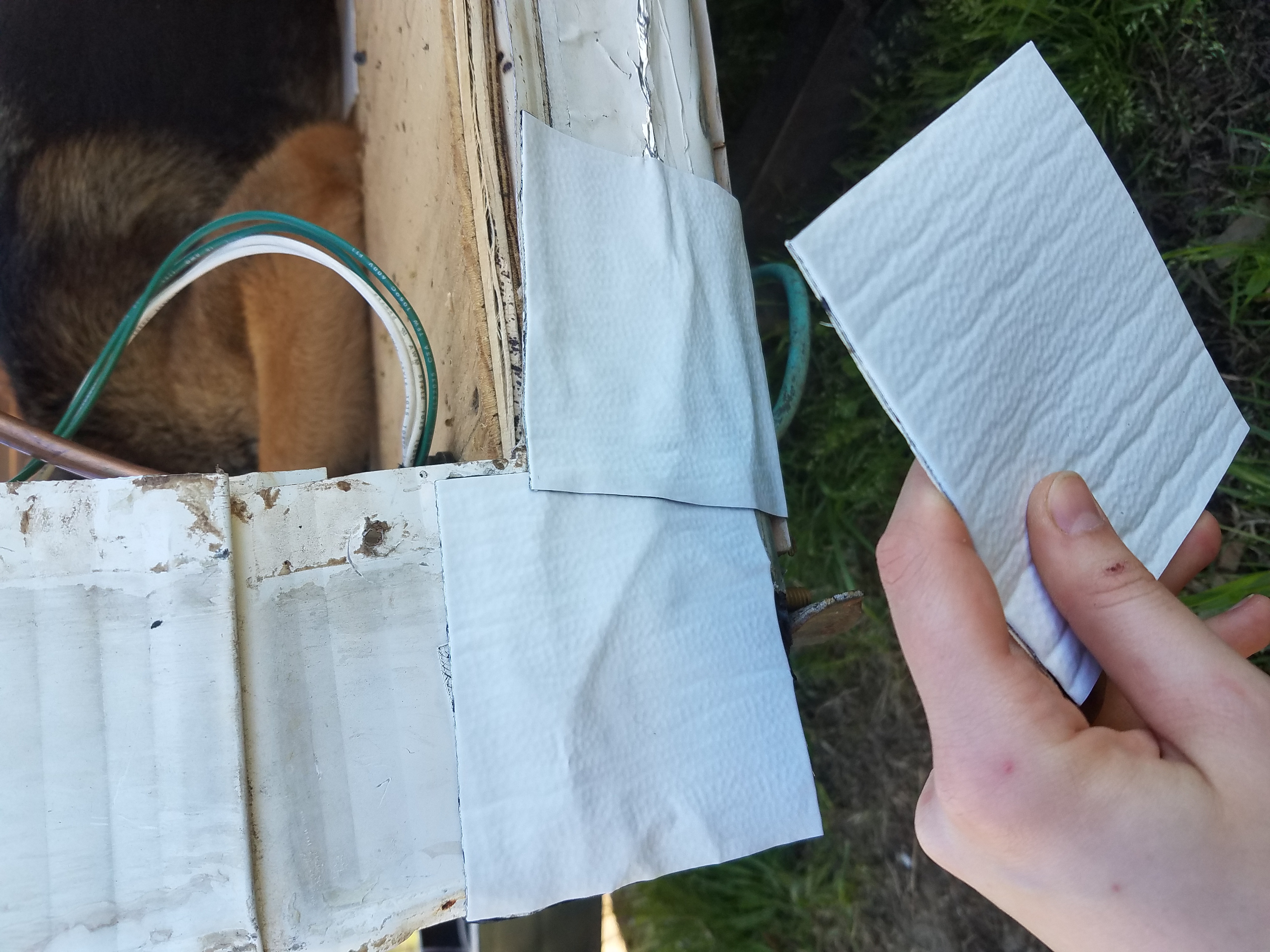 Showing thick tape patches on the aluminum siding